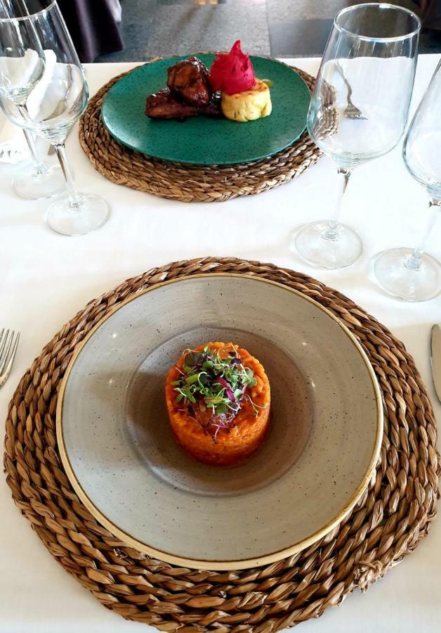 Hospes Palacio De Arenales & Spa Caceres Exterior photo A plate of carrot and coriander soup